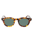 Sunglasses with tortoiseshell frame and green lenses on a white background. - DEI DUCHI
