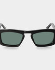 Black sunglasses with green lenses on a light gray background. - Dei Duchi
