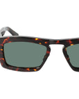 Sunglasses with tortoiseshell frame and green lenses on a light gray background. - De Duchi
