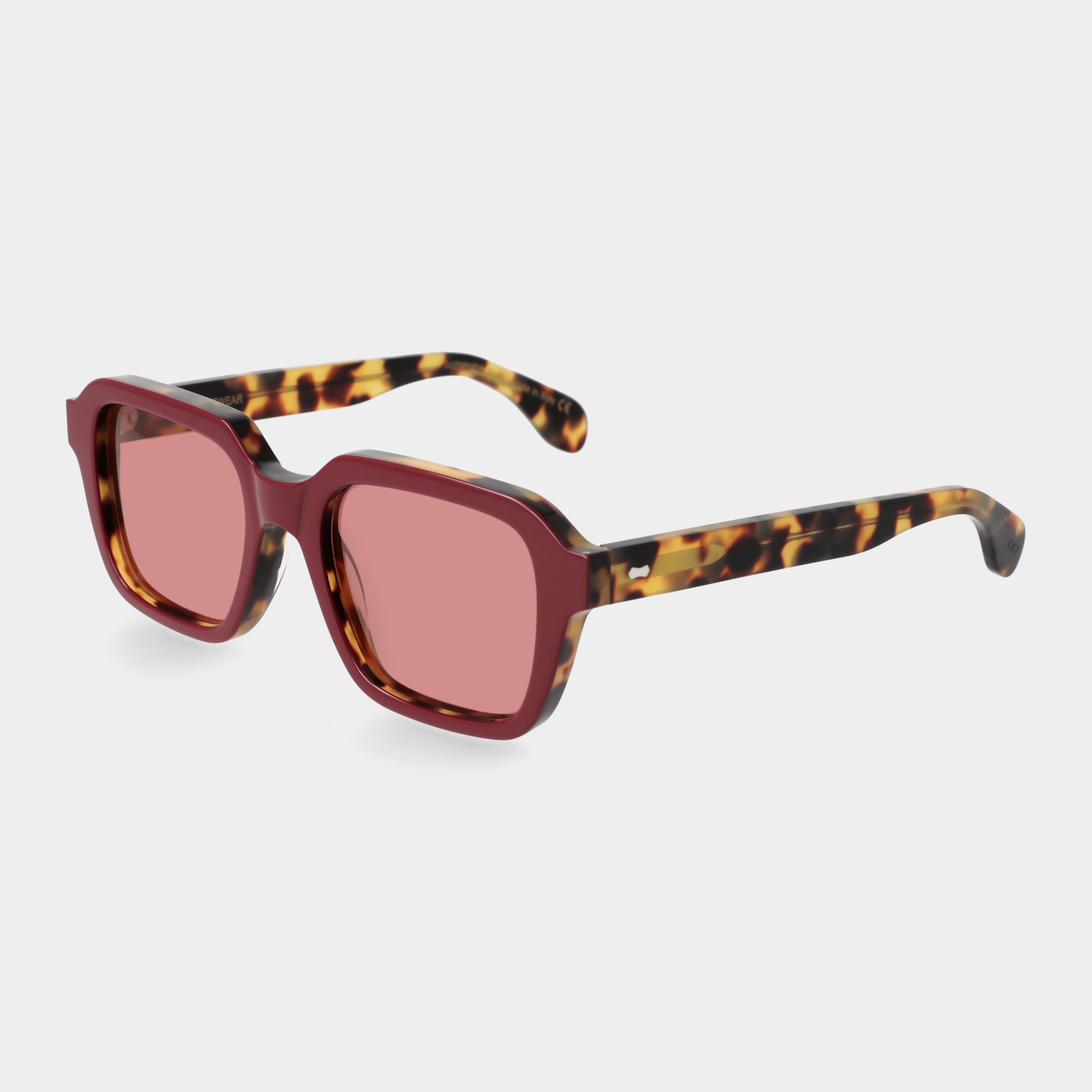 Sunglasses with red-tinted lenses on a light gray background. - Dei Duchi