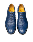Pair of blue dress shoes on a white platform. - Sartoria Dei Duchi-Atri