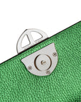 Close-up of a green textured surface with a metallic lock mechanism. - DEI DUCHI ( AMALTEA)