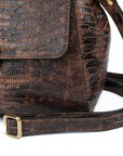 Brown leather textured handbag with a gold clasp on a white background. DEI DUCHI (AMALTEA)