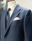 Navy suit with white shirt and tie on a mannequin. - Sartoria Dei-Duchi Atri