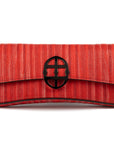 Red handbag with a chain detail, Red clutch bag with a burnished metal emblem on a white background - DEI DUCHI (ALMATEA)