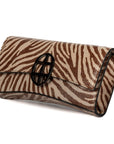 Zebra embossed pinkish leather clutch bag/wallet with a burnished metallic emblem buckle on a white background. - DEI DUCHI (AMALTEA)