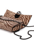 Zebra embossed pinkish leather clutch bag/wallet with a burnished metallic emblem buckle on a white background. - DEI DUCHI (AMALTEA)