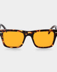 Sunglasses with tortoiseshell frame and orange lenses on a light gray background. - DEI DUCHI