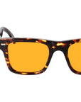 Sunglasses with tortoiseshell frame and orange lenses on a light gray background. - DEI DUCHI