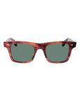Sunglasses with tortoiseshell frame and green lenses on a light gray background. - DEI DUCHI