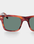 Sunglasses with tortoiseshell frame and green lenses on a light gray background. - DEI DUCHI