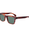 Sunglasses with tortoiseshell frame and green lenses on a light gray background. - DEI DUCHI