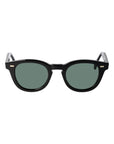 Black sunglasses with green lenses on a white background. - DEI DUCHI