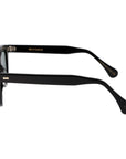Black sunglasses with green lenses on a white background. - DEI DUCHI