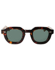 Sunglasses with tortoiseshell frame and dark lenses on a white background. - Dei Duchi