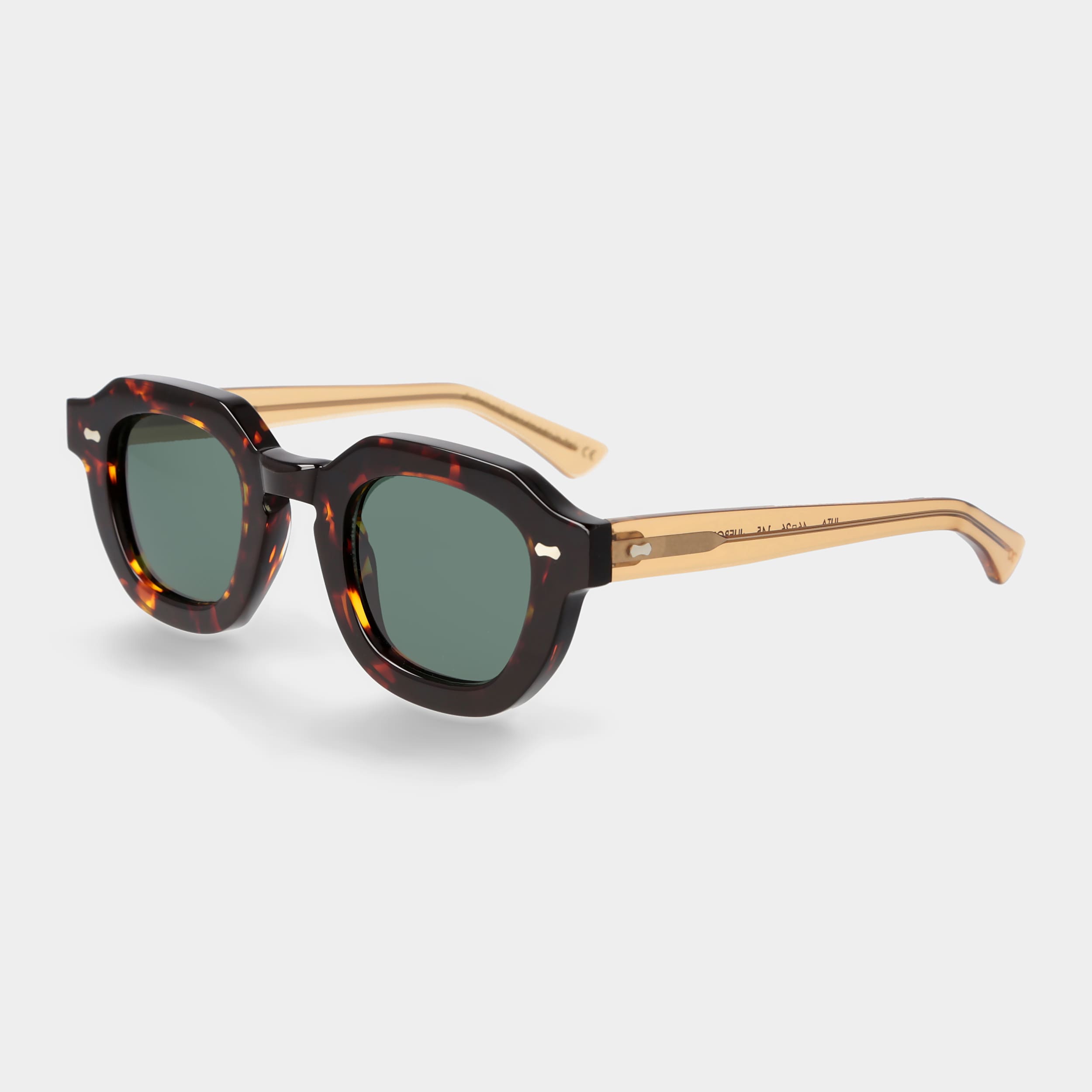 Sunglasses with tortoiseshell frame and dark lenses on a white background. - Dei Duchi