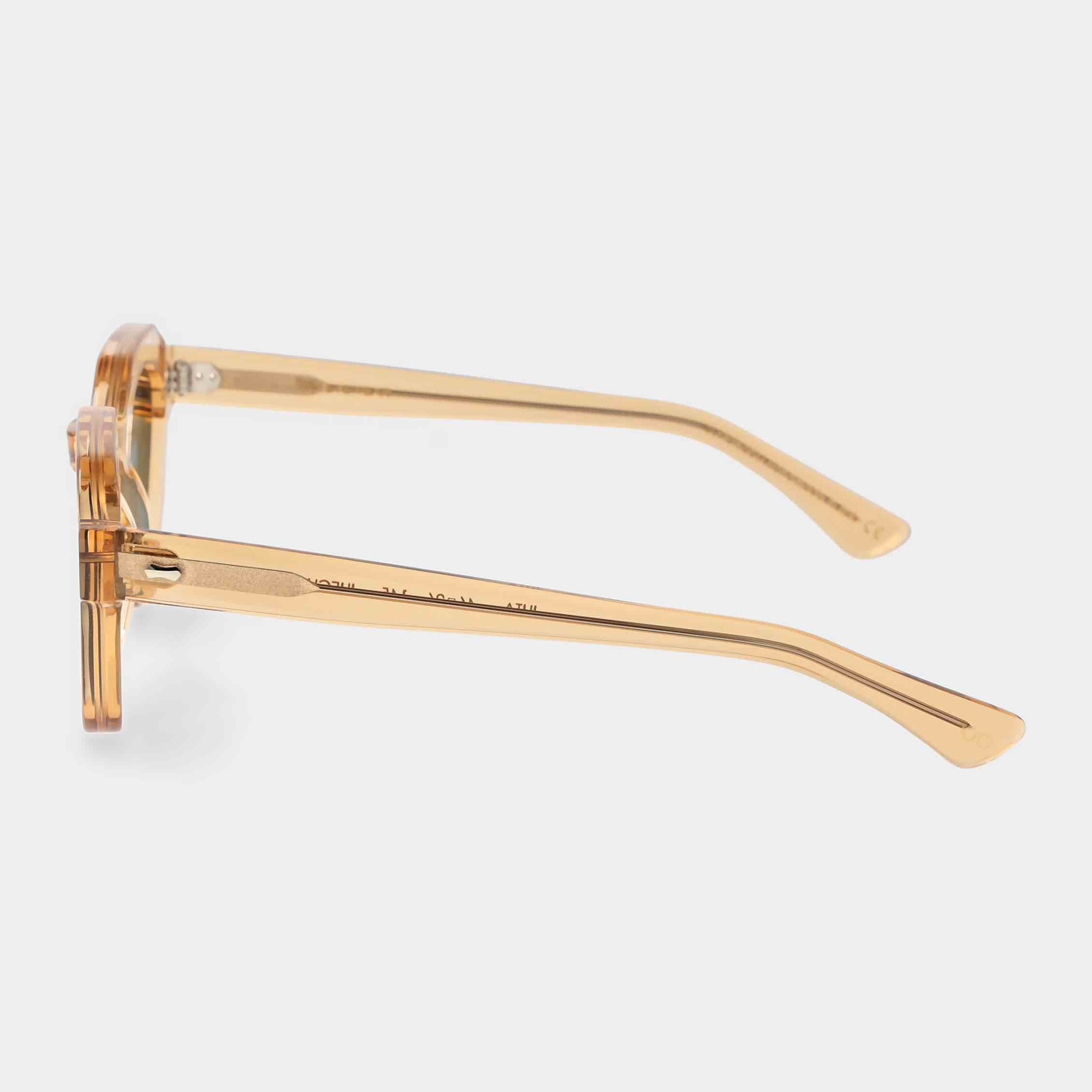 Gold-framed sunglasses with green lenses on a light gray background - Dei Duchi