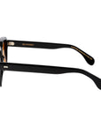 Sunglasses with yellow lenses and black frames on a white background. - DEI DUCHI