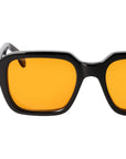 Sunglasses with yellow lenses and black frames on a white background. - DEI DUCHI