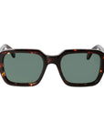 Sunglasses with tortoiseshell frame and green lenses on a light gray background. _ DEI DUCHI