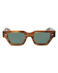 Sunglasses with tortoiseshell frame and green lenses on a white background. - DEI DUCHI