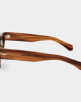 Sunglasses with tortoiseshell frame and green lenses on a white background. - DEI DUCHI