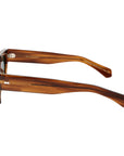 Sunglasses with tortoiseshell frame and green lenses on a white background. - DEI DUCHI