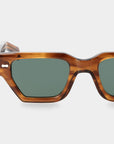 Sunglasses with tortoiseshell frame and green lenses on a white background. - DEI DUCHI