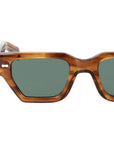 Sunglasses with tortoiseshell frame and green lenses on a white background. - DEI DUCHI