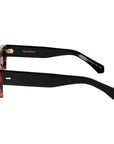 Sunglasses with tortoiseshell frame and dark lenses on a white background. - DEI DUCHI