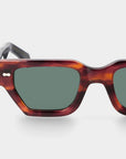 Sunglasses with tortoiseshell frame and dark lenses on a white background. - DEI DUCHI