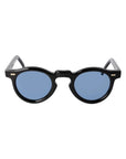 Round sunglasses with black frames and blue lenses on a light gray background. -DEI DUCHI