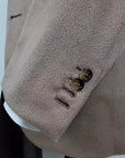 Handmade Cashmere & Vicuna jacket. Single breasted, two-button, 100% Camel Hair versions. Classic pocket trousers, handmade bird's eye pattern. No pleats on front, classic buttoning and belt loop finish. Front American pockets, classic welt pockets w/ button on back. Trousers in cotton finishes and knee pads with lining inside, center slit at the back of the belt. Button holes, pockets, under knack. Suit is fitted, yet extremely comfortable | Sartoria Dei – Duch
