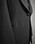 100% Mohair Wool Worsted. Single-breasted jacket w/ one button. Black silk satin shawl collar. Classic pockets. Buttons lined in silk satin. Button holes, pockets, undercollar & finishing touches are handmade. Fitted yet extremely comfortable. TROUSERS: Classic Tuxedo, w/ side band black silk satin. One pleats, slim, w/ internal buttons for suspenders w/ a black silk satin cummerbund & the sweet touch of a black bow-tie.  Also available in blue.|Sartoria Dei Duchi-Atri