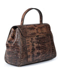 Brown textured handbag with a gold clasp on a white background. DEI DUCHI (AMALTEA)