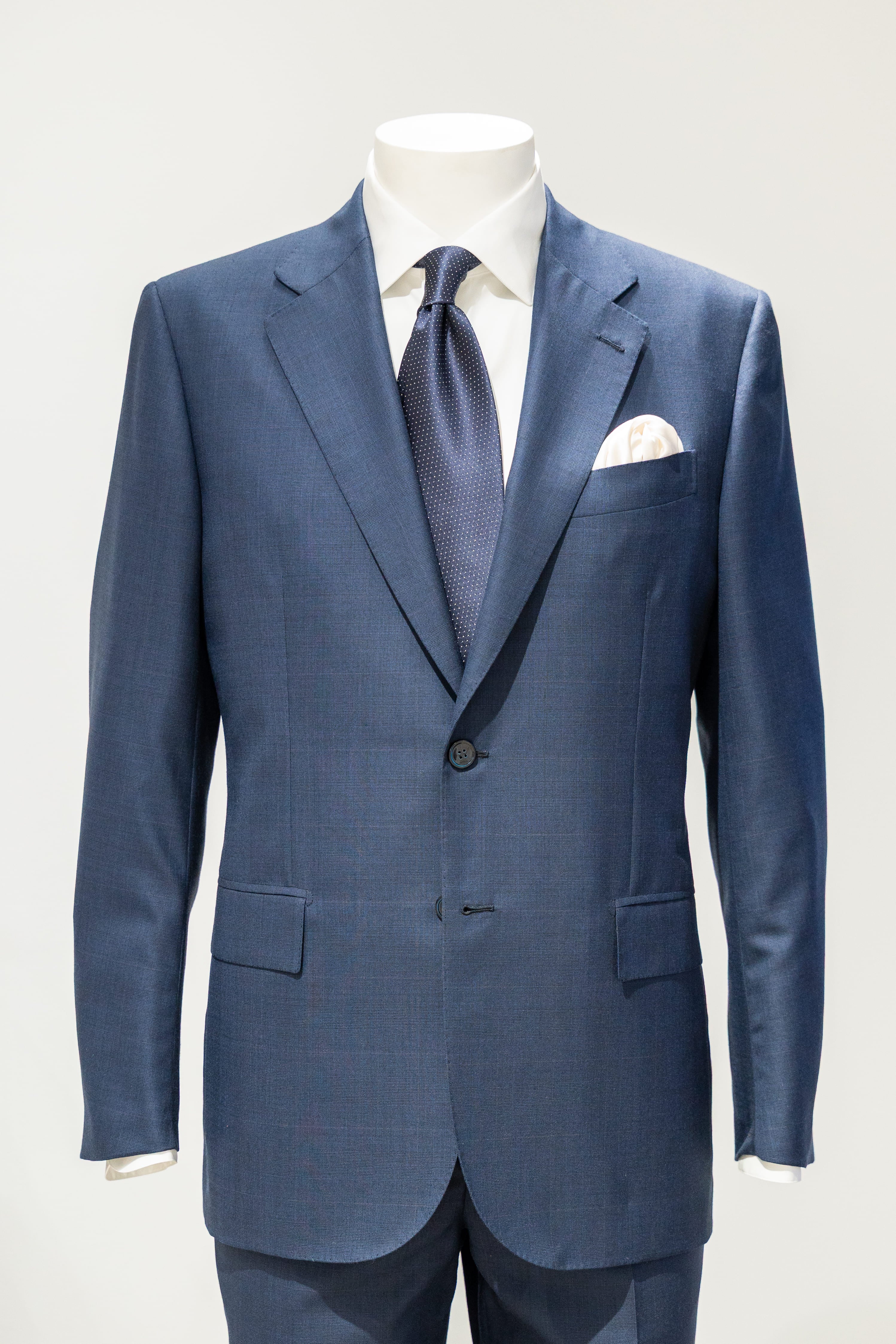 Blue suit with matching tie and pocket square on a mannequin against a white background. - Sartoria Dei Duchi-Atri