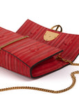 Red handbag with a chain detail, Red clutch bag with a gold emblem on a white background - DEI DUCHI (ALMATEA)