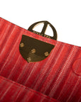 Red handbag with a chain detail, Red clutch bag with a gold emblem on a white background - DEI DUCHI (ALMATEA)