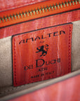 Red handbag with a chain detail, Red clutch bag with a gold emblem on a white background - DEI DUCHI (ALMATEA)