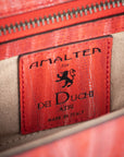Red handbag with a chain detail, Red clutch bag with a gold emblem on a white background - DEI DUCHI (ALMATEA)