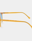 Sunglasses with yellow frame and blue lenses on a white background. - DEI DUCHI