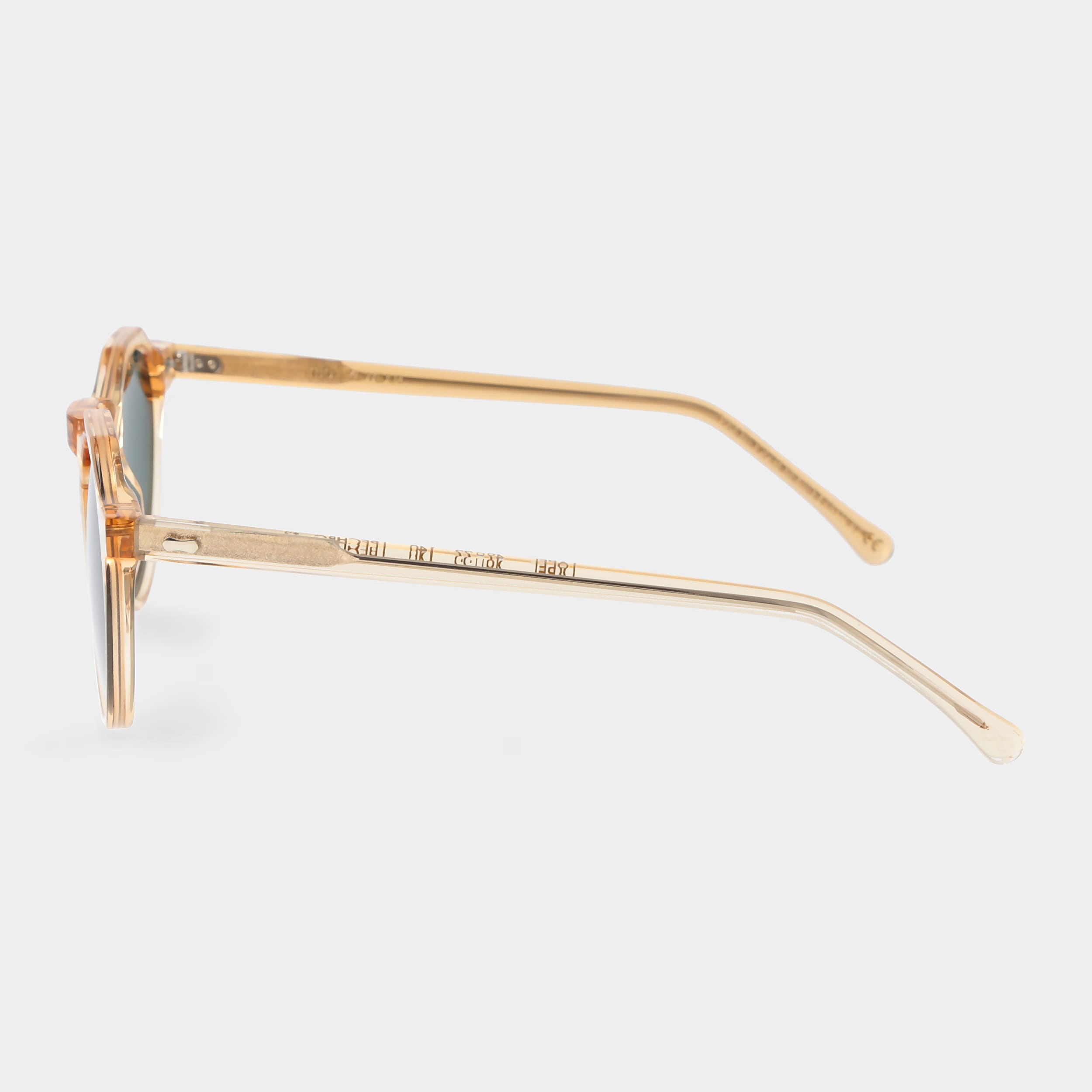 Gold-framed sunglasses with green lenses on a light gray background. - DEI DUCHI