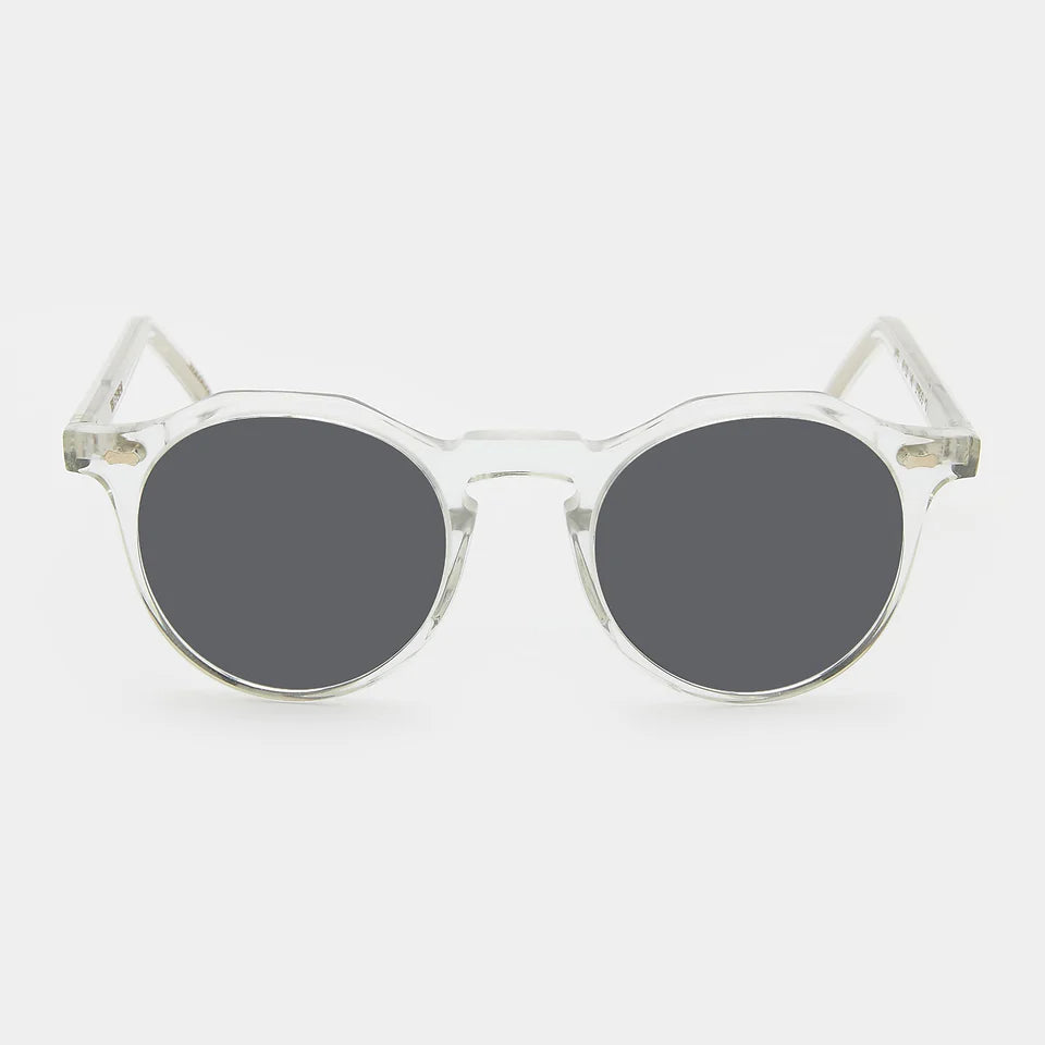 Round sunglasses with clear frame and dark lenses on a white background. - DEI DUCHI