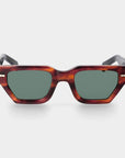 Sunglasses with tortoiseshell frame and dark lenses on a white background. - DEI DUCHI
