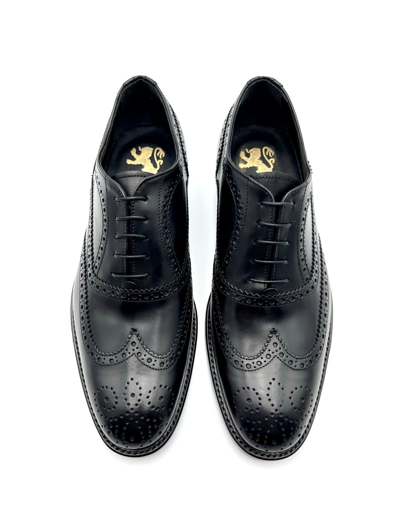 Oxford shoe in English style with dovetail hole and  flower in toe, 100% made in Italy, in genuine calfskin,  The leather sole with half rubber seedling makes it non-slip and the  seam BLAKE ensures the tightness of the bottom Process: blake- Leather: abrasive calf -  Color: black - Lining: black calf -  Bottom: leather - Insole: leather Handcrafted shoes, made in Italy with genuine 100% Italian leather.- Sartoria Dei Duchi-Atri