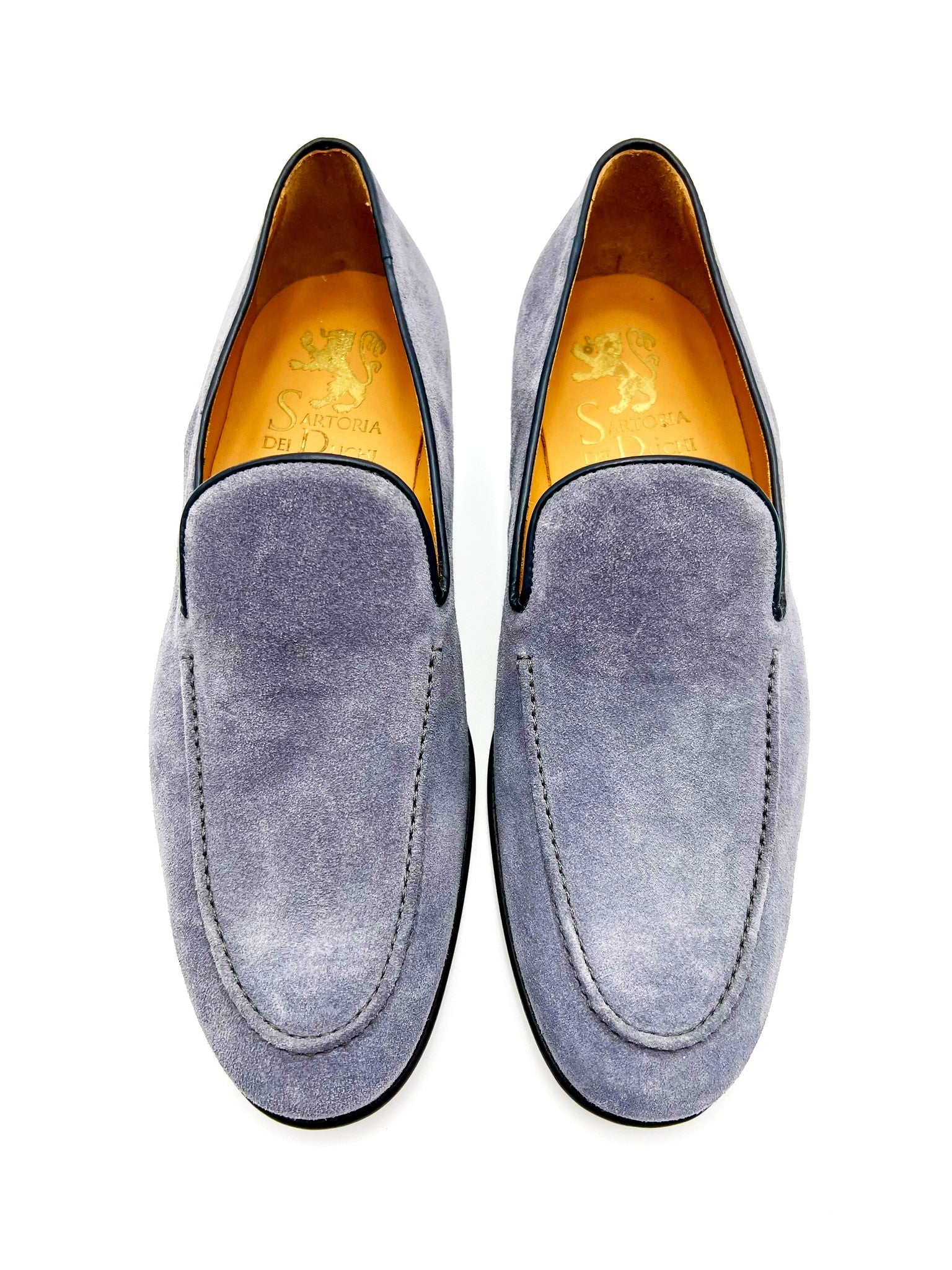 Loafers 100% MADE IN ITALY, in soft suede calfskin,  bottom with lightweight leather sole, BLAKE stitching  and leather bombé bottom. The color is a fresh elegant  middle grey blue. Shape with regular plant suitable for  a wide audience. These shoes guarantee class and style,  combined with comfort typical of loafers. Process: blake   Leather: suede calfskin    Colour : light blue grey    Lining: calf leather   Bottom: bumble leather    Insole: leather - Sartoria Dei Duchi-Atri