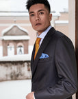 Acquaviva suit, in pure worsted wool - available in Super 150s, 170s and 200s.Single-breasted two-button jacket, with classic lapel and two slits on the back. Buttonholes, pockets, garments and all finishes are handmade.The slim trousers present one pleats and are realized without flap on the bottom.| Sartoria Dei Duchi - Atri