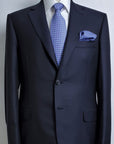 Acquaviva suit, in pure worsted wool - available in Super 150s, 170s and 200s.Single-breasted two-button jacket, with classic lapel and two slits on the back. Buttonholes, pockets, garments and all finishes are handmade.The slim trousers present one pleats and are realized without flap on the bottom.| Sartoria Dei Duchi - Atri