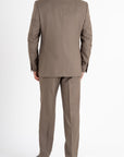 This Sartoria dei Duchi suit is made in two pieces with the finest fabric of Caccioppoli “Kingdom” Super 150’s in 100% virgin wool, in an elegant dark beige color. This elegant suit is composed of a two-button jacket with classic lapel and flap pockets. Pants are realized without pleats, regular waist, American style pockets.