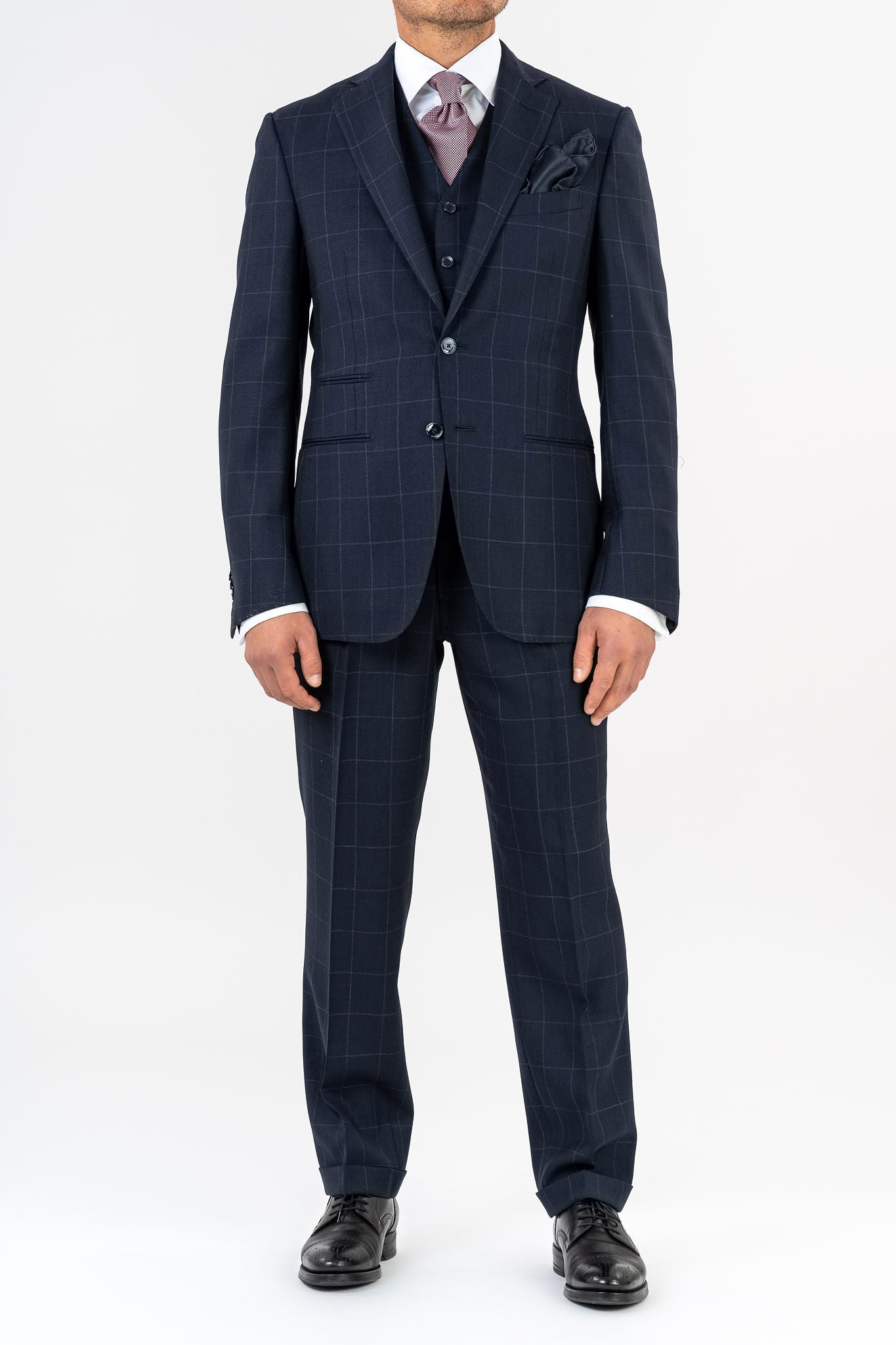 Three-piece suit, made with Loro Piana’s &quot;Sopra Visso&quot; wool, single-breasted,composed of a jacket with 2 buttons and welt pockets with a pocket for watch. Classic lapel and blue mother of pearl buttons. The elegant gilet has 5 buttons,the back has been made with elegant lining.The trousers have a regular waist and has only one dart,without loops with side buckle and predisposition for suspenders.Genuinely made in Italy by Sartoria dei Duchi